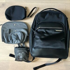Samsonite black backpack with silver hardware plus travel accessories